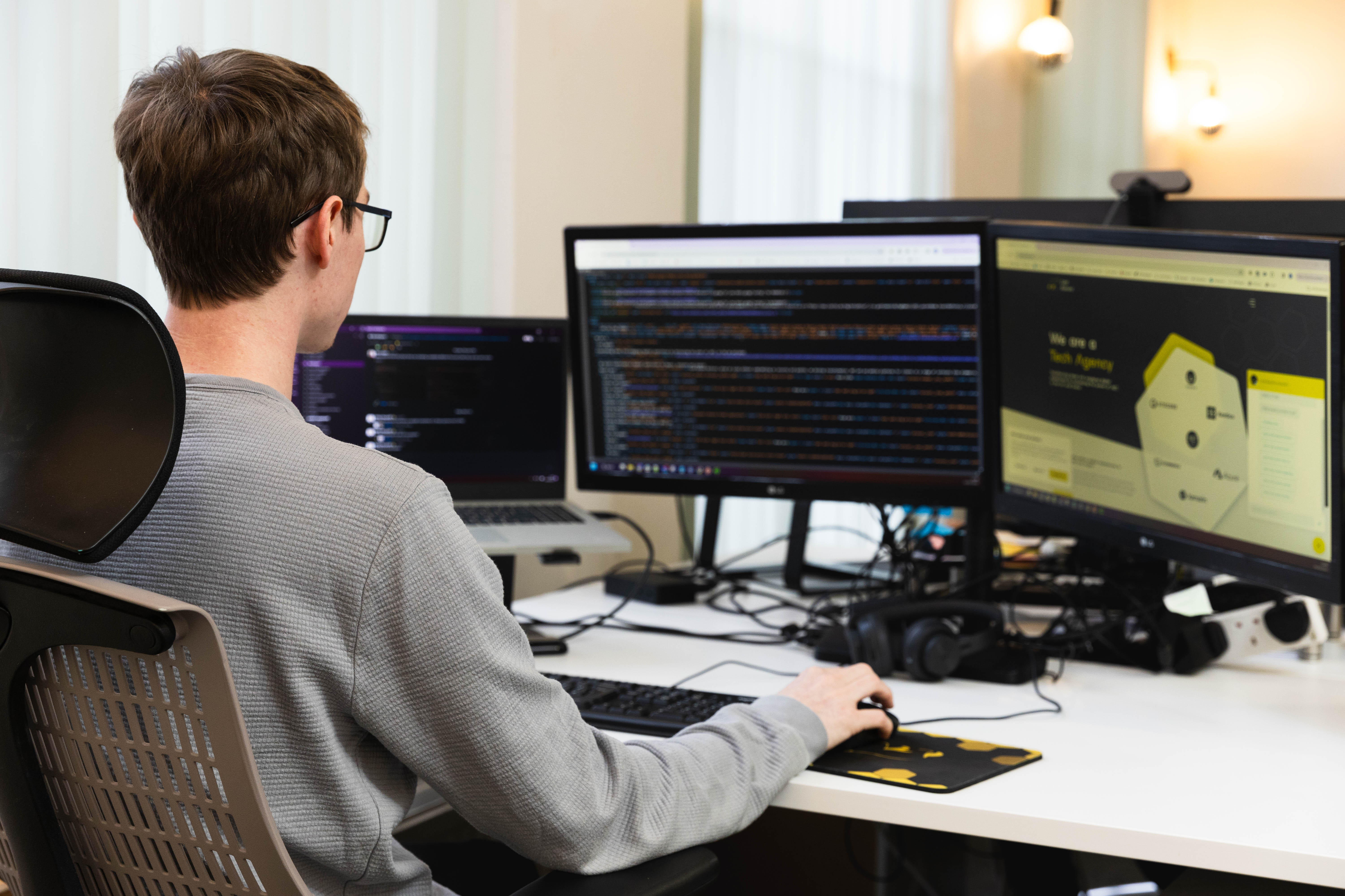 Cold Banana employee in Cold Banana HQ coding the Cold Banana website.