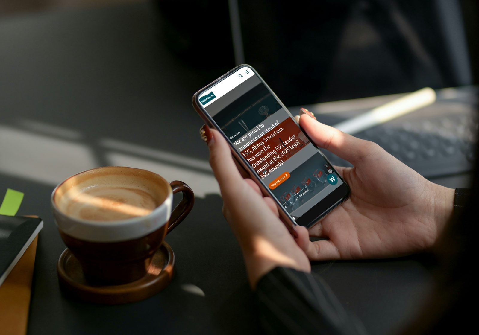 The Weightmans website on a phone, showing a news story about an award