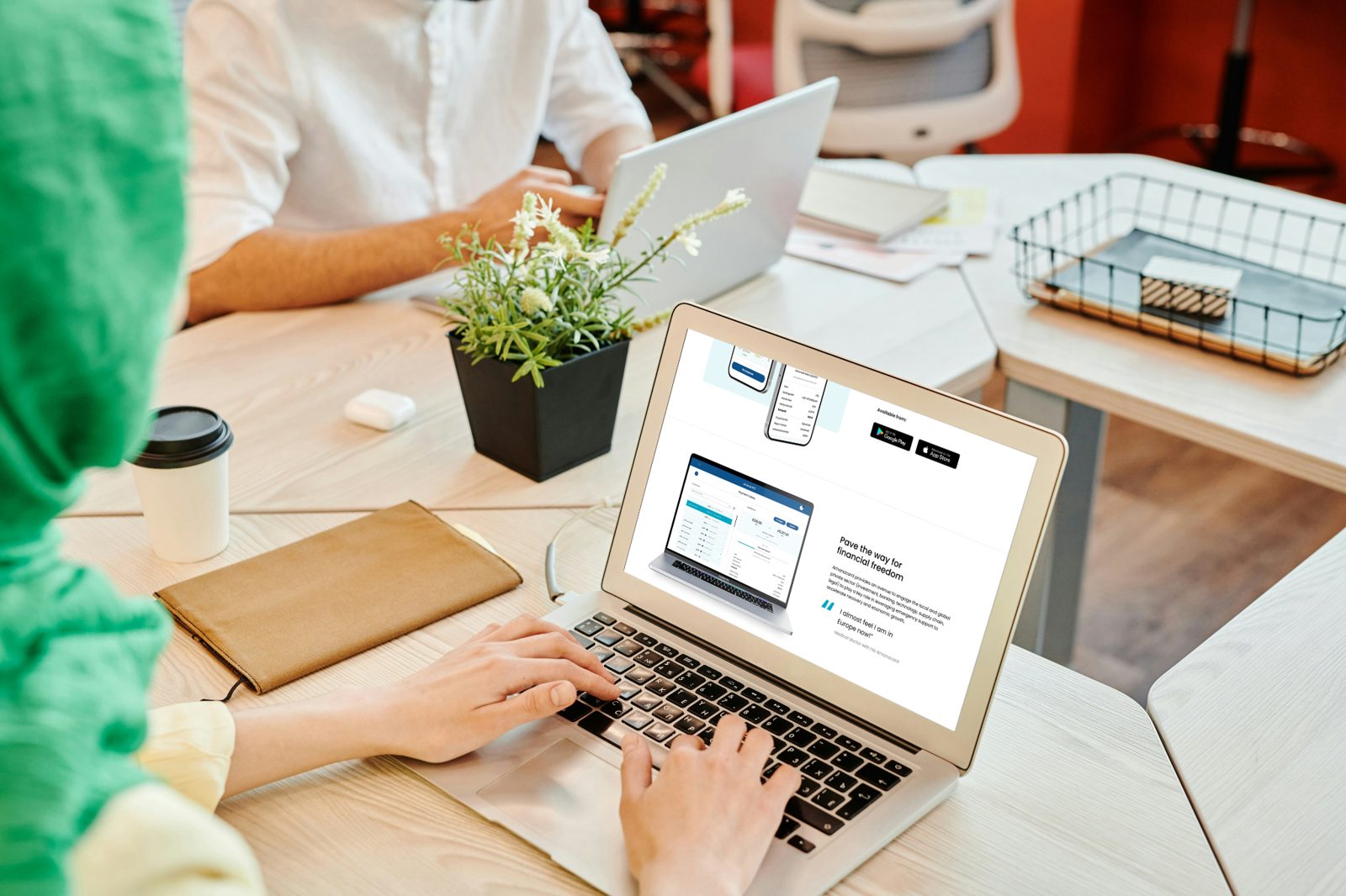 The Amanacard website on a laptop, with the service shown on a phone and a desktop.
