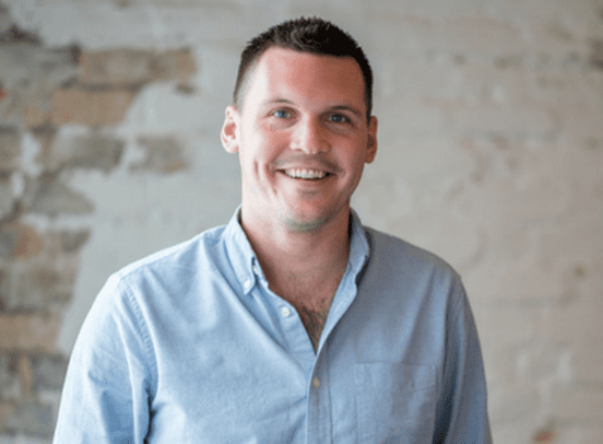 A photo of CEO Luke Fribbens wearing a light blue shirt.