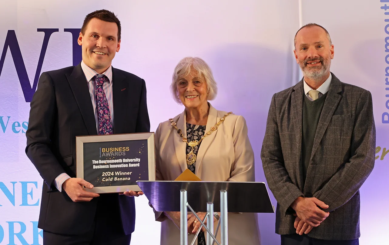 Cold Banana CEO Luke Fribbens on stage at the 2024 Bournemouth Business Awards accepting the Business Innovation Award.