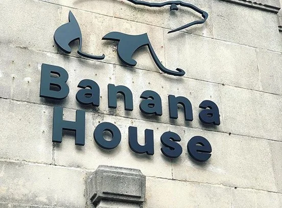Cold Banana's office sign, with the polar bear glyph placed above test that reads "Banana House".