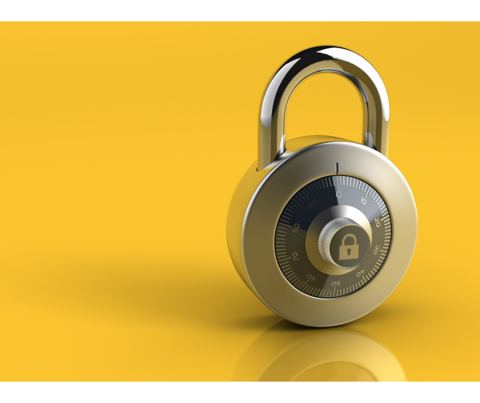 A silver dial combination padlock on a yellow background.
