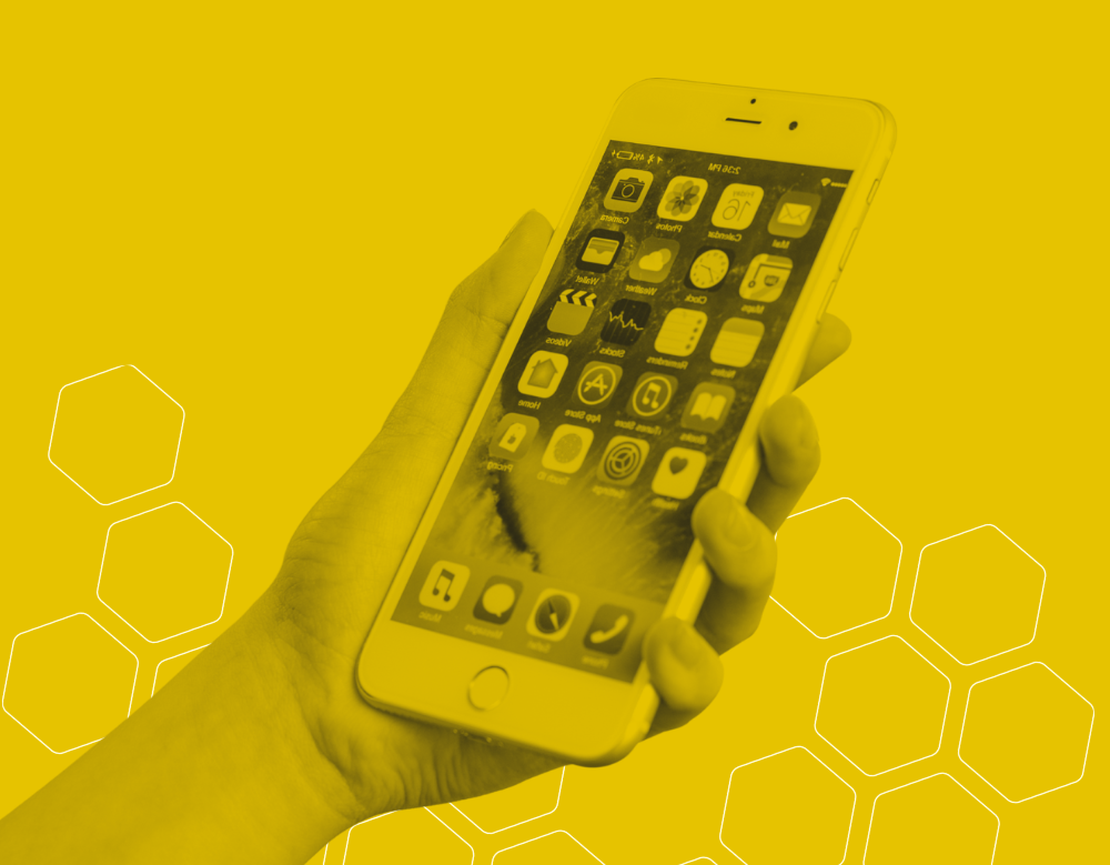 A black and yellow graphic of a person holding an iPhone