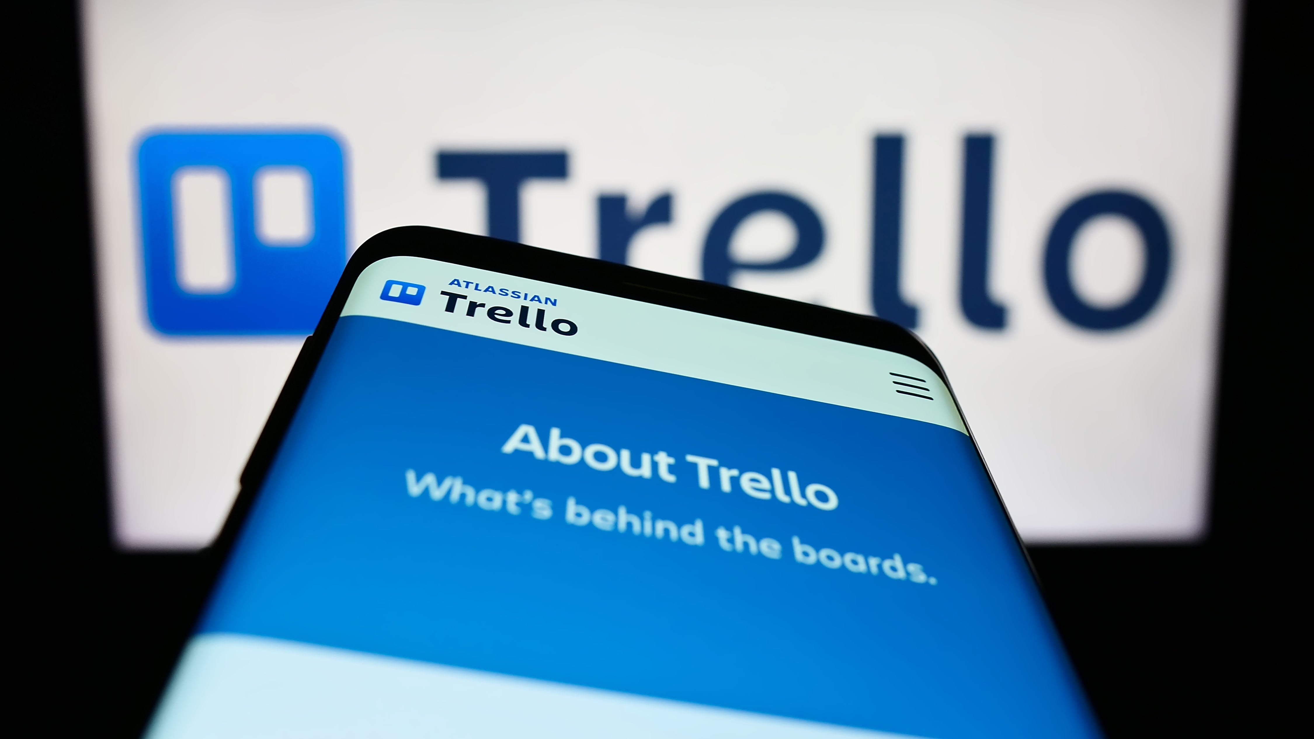Trello open on a smartphone and a desktop