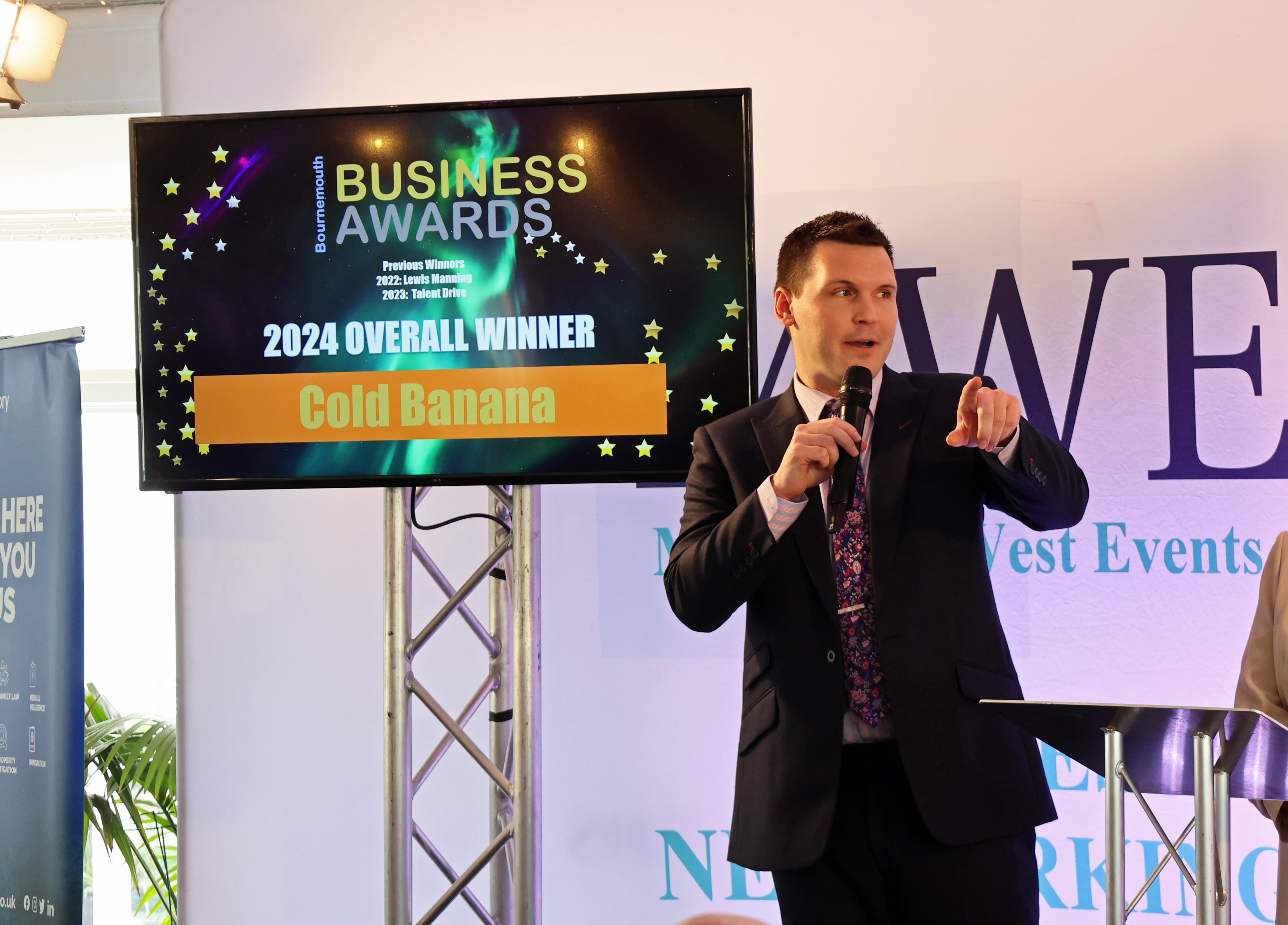 Cold Banana CEO Luke Fribbens on stage at Bournemouth Business Awards 2024 after winning 2024 Overall Winner.