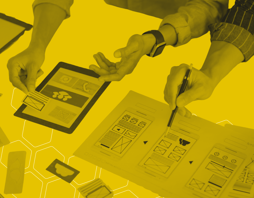 A black and yellow graphic of two people organising the layout of an app