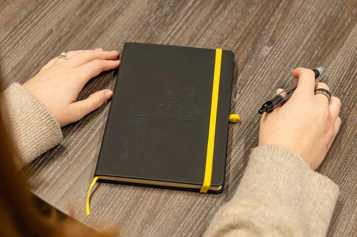 Cold Banana employee with branded notebook.