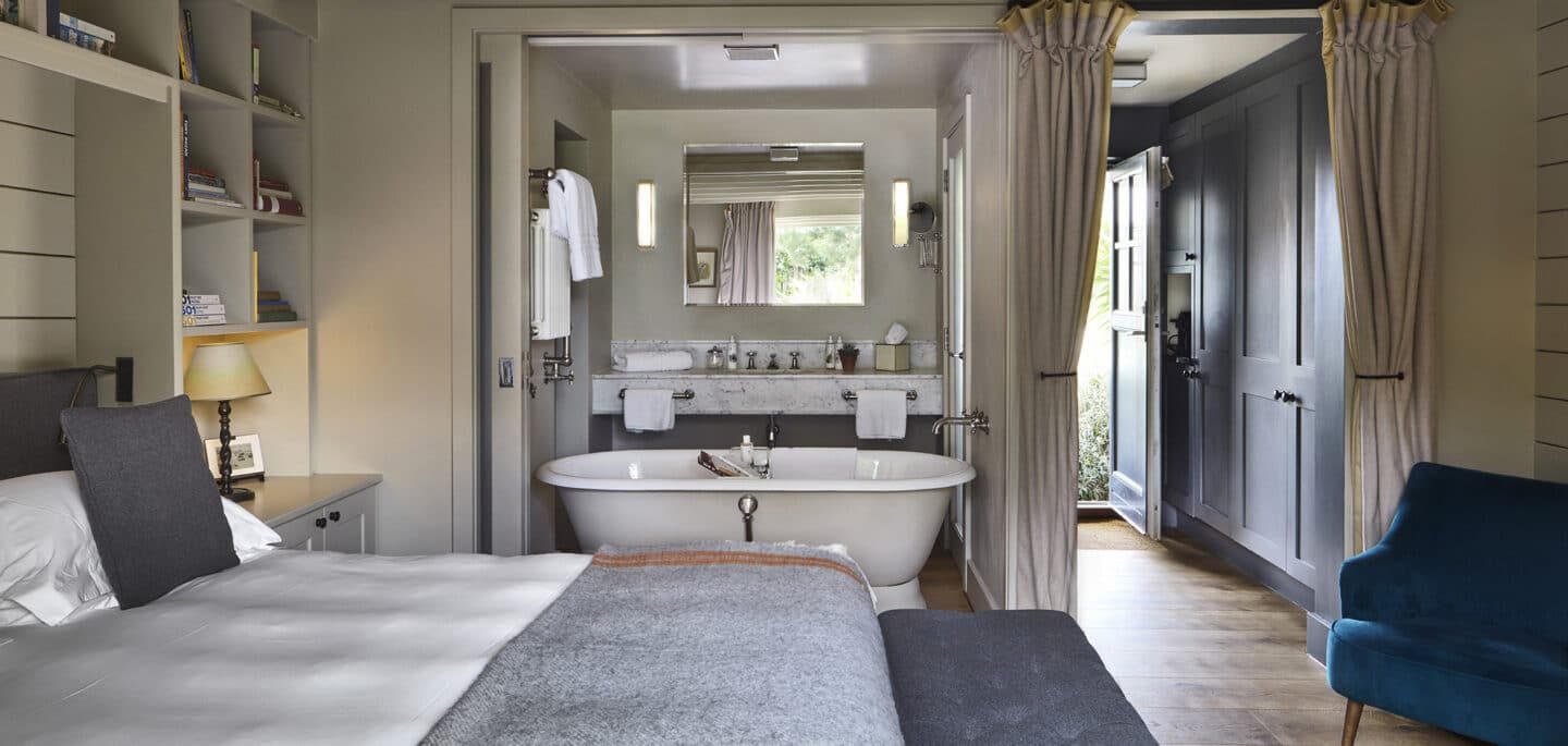 A bedroom and freestanding bath at The Gallivant