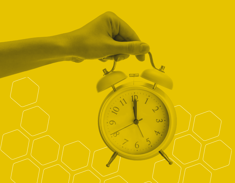 A black and yellow graphic of a person holding an analogue alarm clock