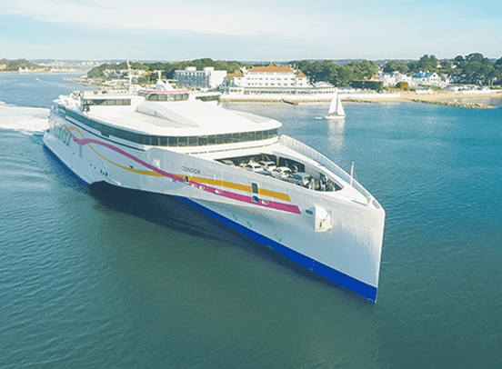 Condor ferries boat pulling up to a harbour