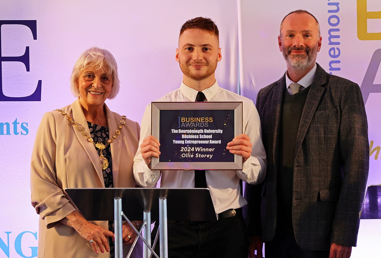 Ollie Storey on stage at the 2024 Bournemouth Business Awards accepting his Young Entrepreneur award